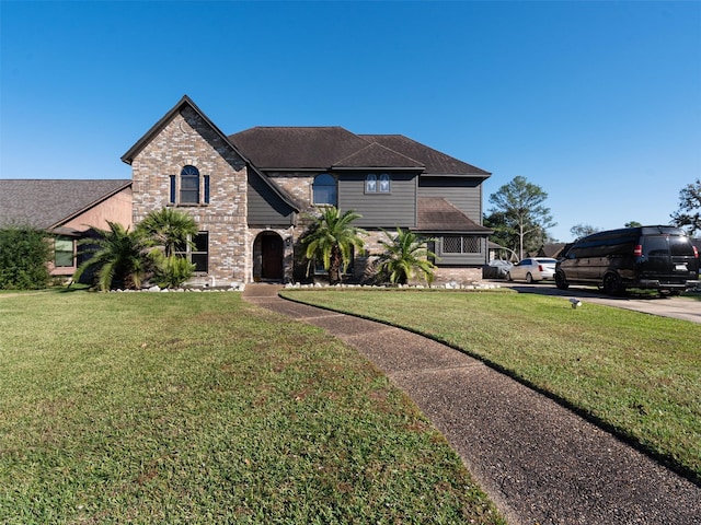 view of front of property with a front lawn