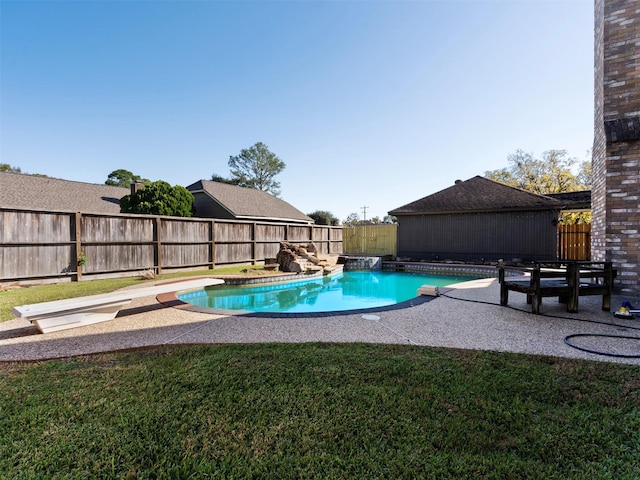 view of swimming pool featuring a patio and a lawn