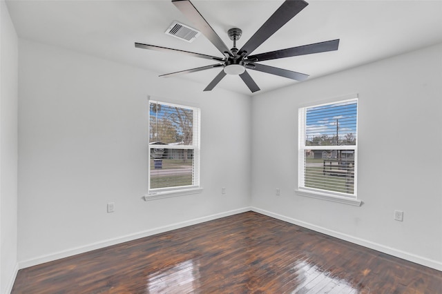 unfurnished room with ceiling fan and dark hardwood / wood-style floors