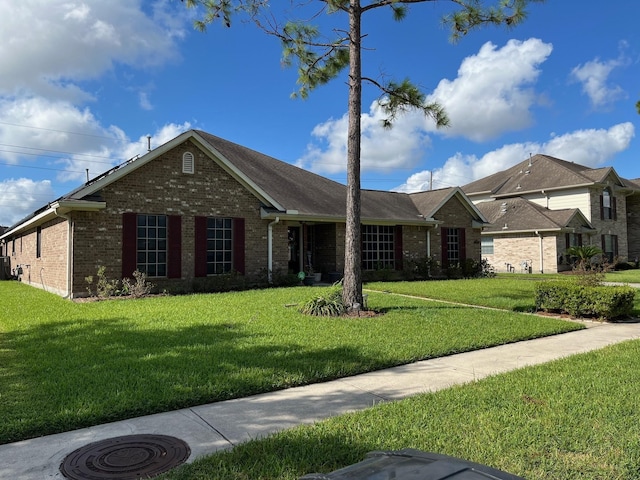 ranch-style house with a front yard