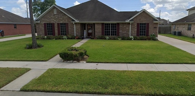 single story home with a front lawn