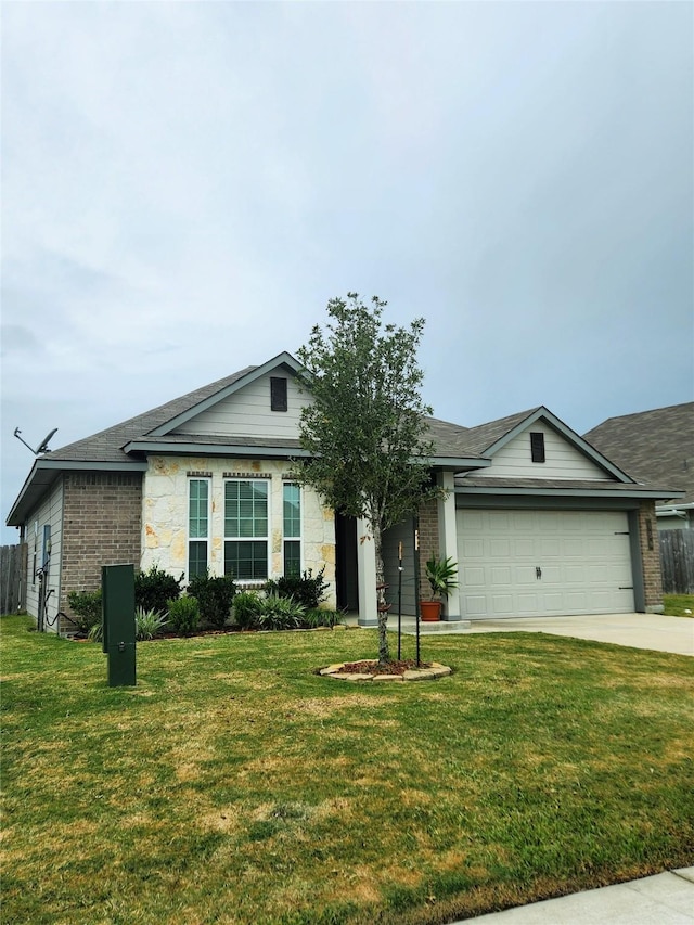 single story home with a front yard and a garage