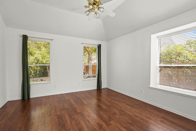 unfurnished room featuring dark hardwood / wood-style floors, a healthy amount of sunlight, and lofted ceiling