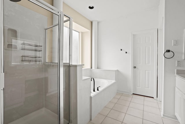 bathroom featuring tile patterned floors, vanity, and separate shower and tub