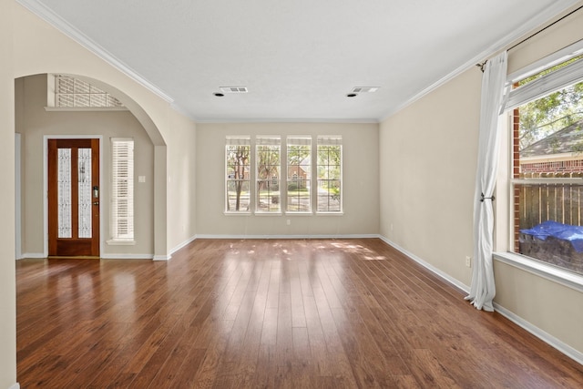 foyer entrance featuring crown molding and dark wood-type flooring