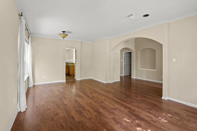 unfurnished room featuring dark hardwood / wood-style floors and crown molding