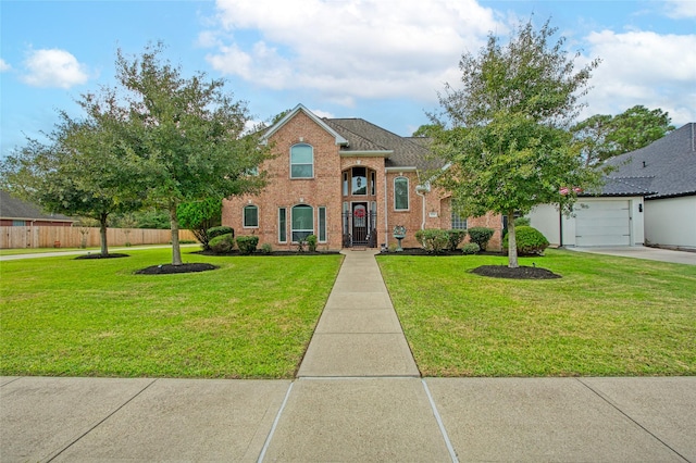 view of front of house with a garage and a front yard