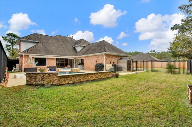 back of property featuring a patio and a lawn