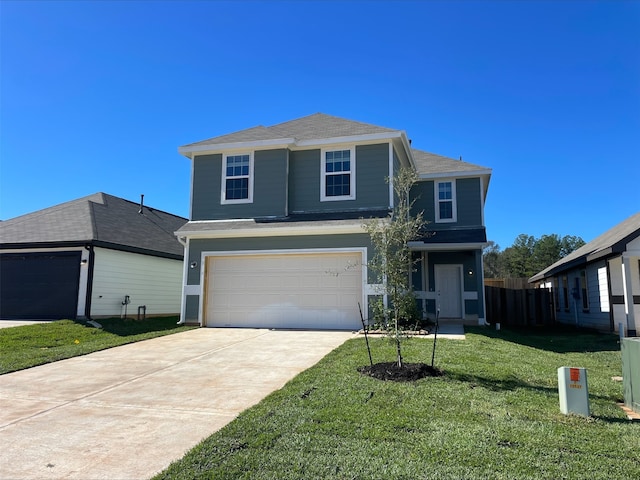 front of property featuring a garage and a front lawn