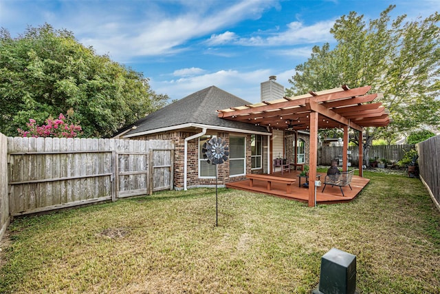 back of property featuring a lawn, a pergola, and a wooden deck