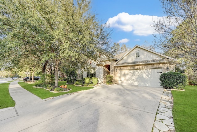 view of front of house featuring a front yard and a garage