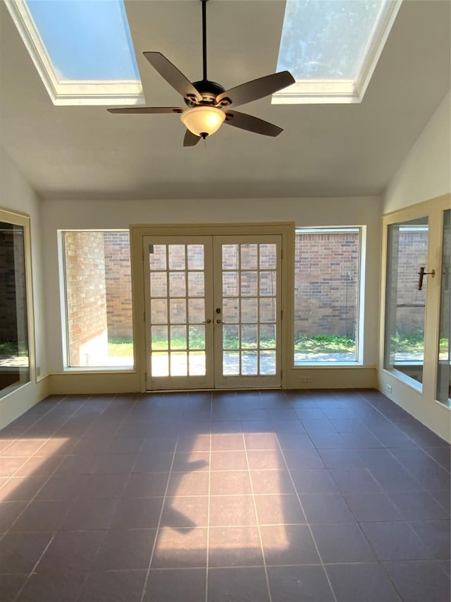 unfurnished sunroom with ceiling fan, french doors, and lofted ceiling