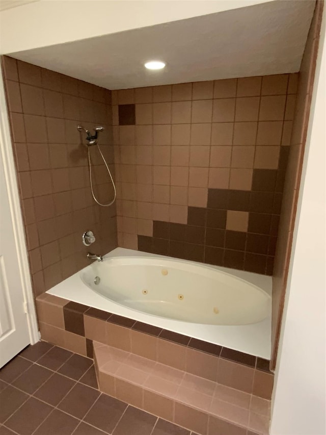 bathroom with tile patterned flooring and tiled shower / bath