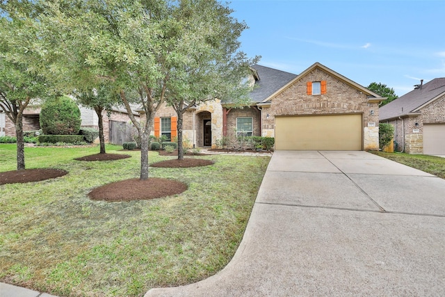 view of front of house featuring a garage and a front lawn