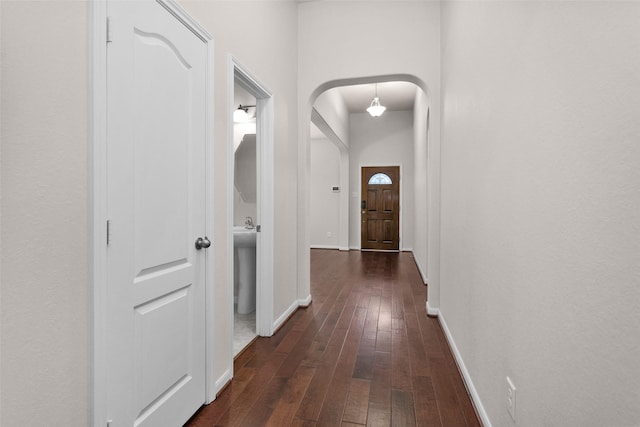 corridor featuring dark hardwood / wood-style floors