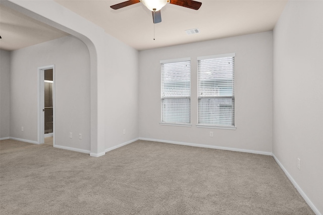 unfurnished room with light carpet and ceiling fan