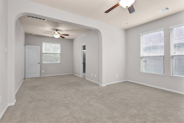 carpeted empty room with ceiling fan