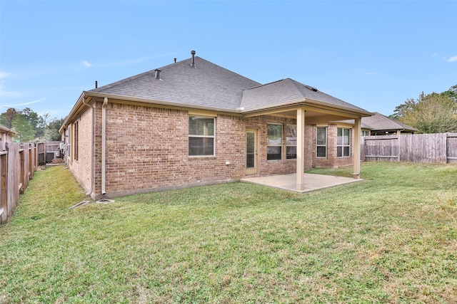 back of property featuring a patio area and a lawn