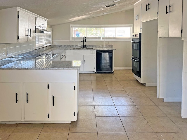 kitchen featuring lofted ceiling, white cabinets, black appliances, and a textured ceiling