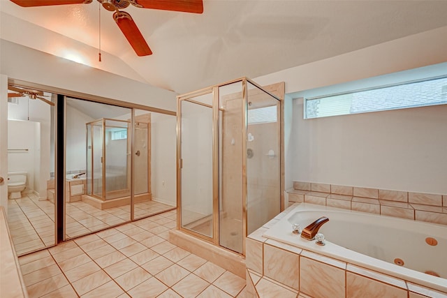 bathroom with lofted ceiling, a garden tub, toilet, a shower stall, and tile patterned floors