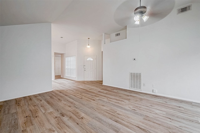 interior space featuring ceiling fan, light wood-style flooring, and visible vents