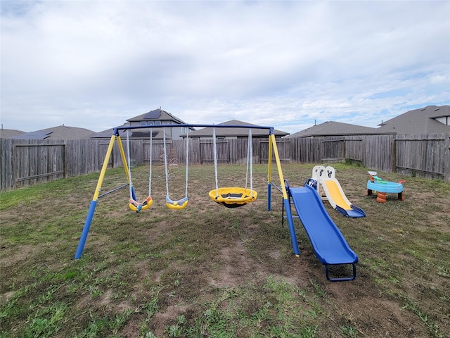 view of playground featuring a lawn