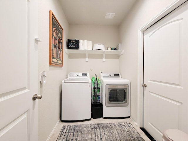 washroom with washing machine and dryer