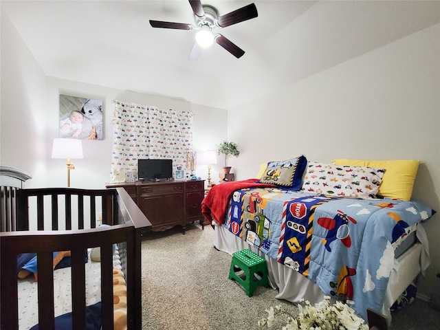 bedroom featuring ceiling fan and carpet