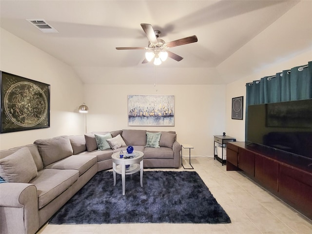 living room featuring light tile patterned floors, ceiling fan, and lofted ceiling