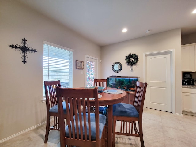 dining area with light tile patterned flooring