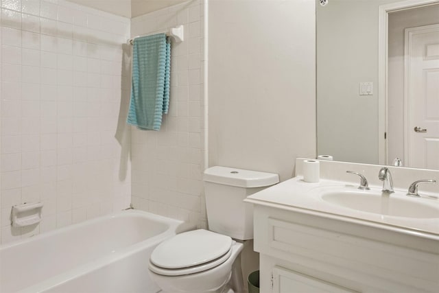 full bathroom with vanity, toilet, and tiled shower / bath