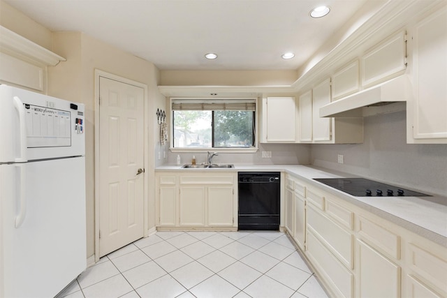 kitchen with sink, light tile patterned floors, and black appliances