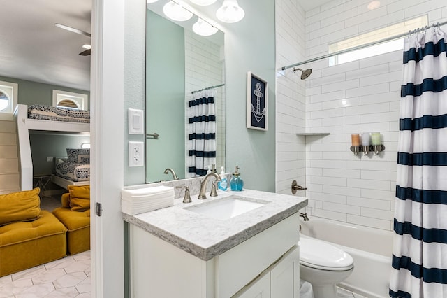 full bathroom with tile patterned flooring, shower / tub combo with curtain, vanity, and toilet