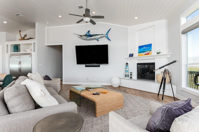 living room featuring ceiling fan, light wood-type flooring, lofted ceiling, and wooden ceiling