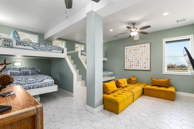 bedroom featuring light tile patterned floors and ceiling fan