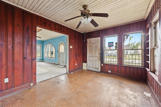 interior space featuring ceiling fan and wood ceiling