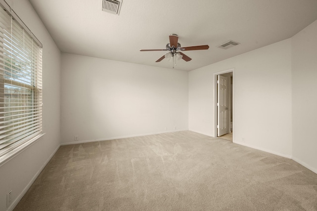 carpeted empty room with ceiling fan