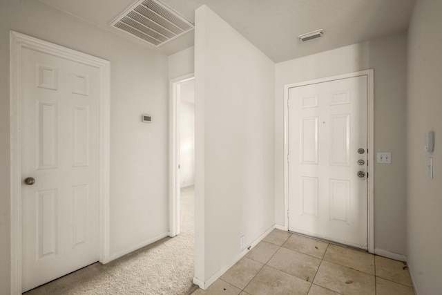 entrance foyer featuring light tile patterned floors