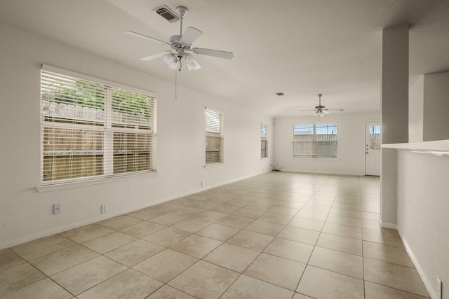 unfurnished room featuring ceiling fan and light tile patterned floors