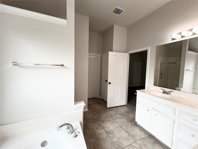 bathroom with plus walk in shower, vanity, tile patterned floors, and ornamental molding