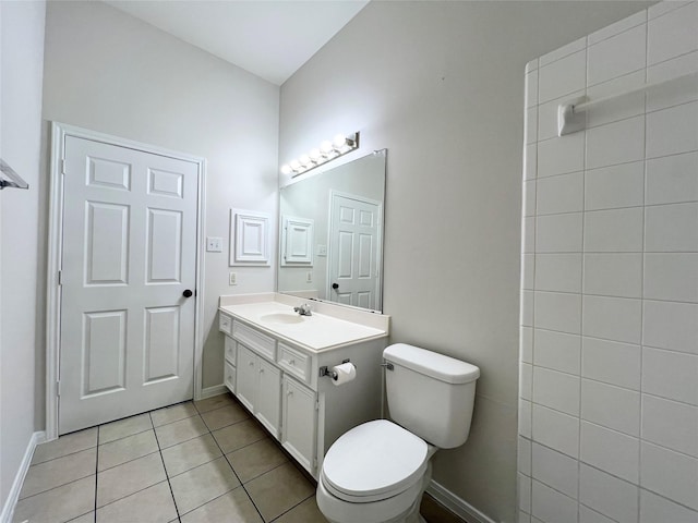 bathroom featuring tile patterned flooring, vanity, and toilet