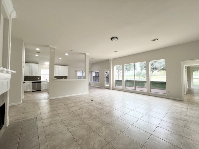 unfurnished living room with light tile patterned floors