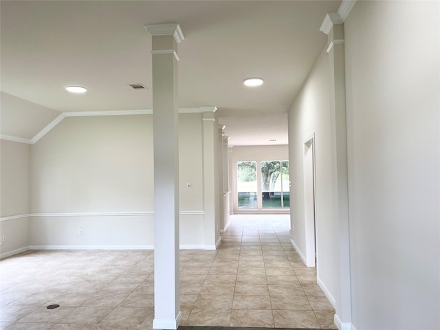 corridor featuring light tile patterned floors, lofted ceiling, and crown molding