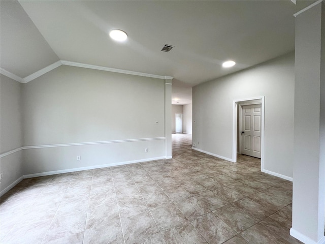 empty room with lofted ceiling and ornamental molding