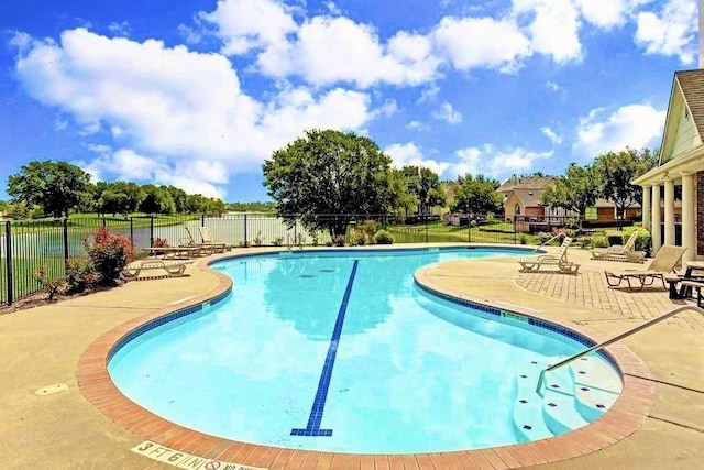 view of swimming pool with a patio