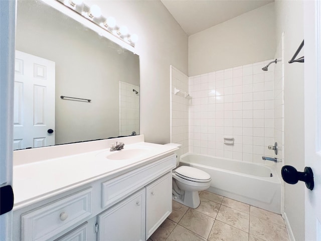 full bathroom featuring tile patterned flooring, vanity, toilet, and tiled shower / bath