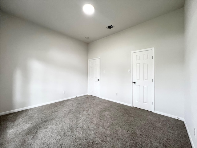 spare room featuring carpet