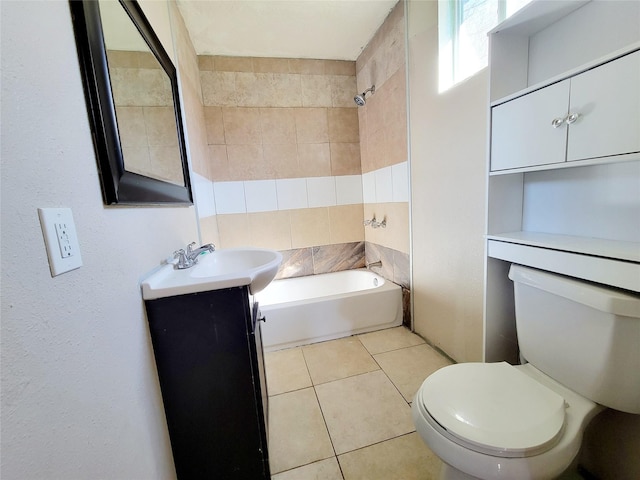 bathroom with tile patterned flooring, vanity, and toilet