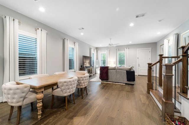 dining area with ceiling fan and dark wood-type flooring