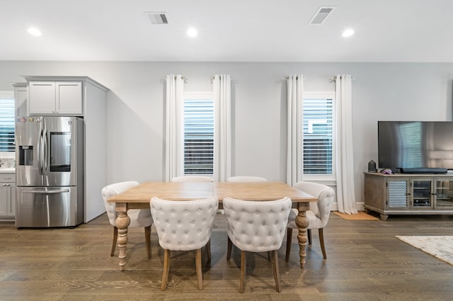 dining area with dark hardwood / wood-style floors